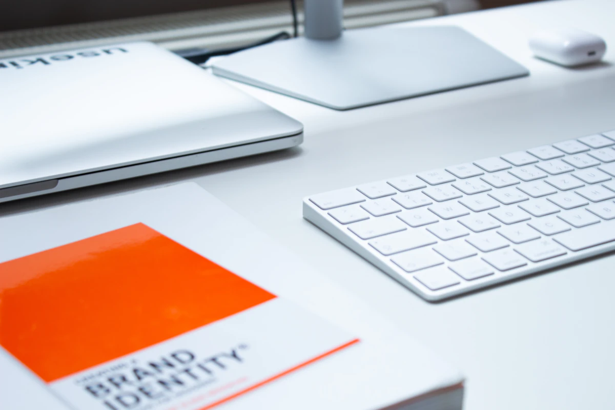 Creative studio workspace with laptop and design tools laid out
